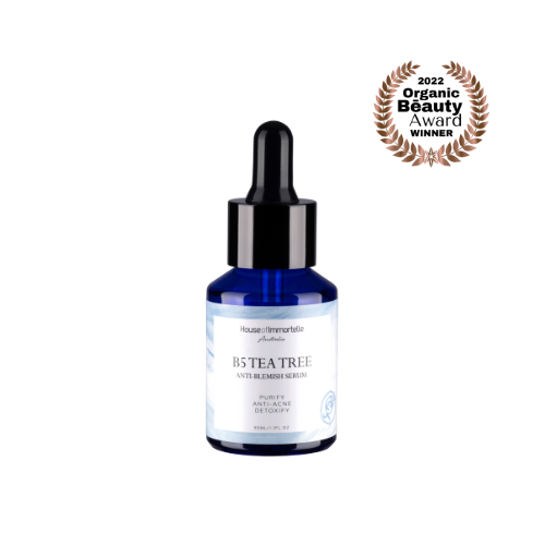 House of Immortelle B5 Tea Tree Anti-Blemish Serum in a sleek bottle, formulated with tea tree oil and vitamin B5 to target blemishes and soothe the skin. This lightweight serum helps reduce the appearance of acne and blemishes, leaving the skin clear and balanced