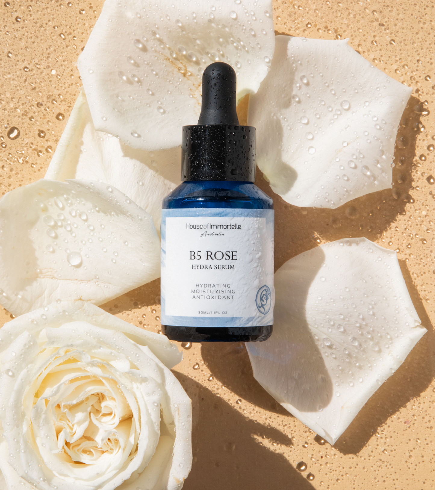 House of Immortelle B5 Rosr Hydra Serum bottle with a sleek design and dropper cap. The serum is designed to deeply hydrate and soothe the skin, enriched with Vitamin B5 and rose extracts for a refreshed and radiant complexion