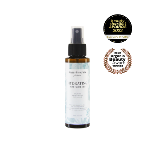 House of Immortelle Hydrating Rose Facial Mist in a sleek spray bottle, infused with rose extract to refresh and hydrate the skin. This mist provides a soothing, dewy glow, perfect for revitalizing the skin throughout the day or setting makeup