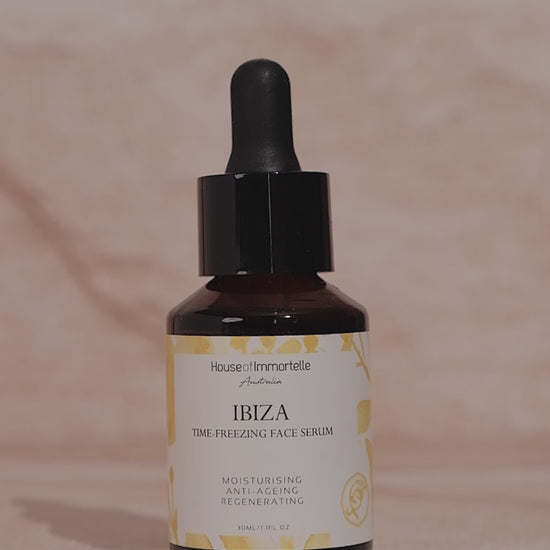 House of Immortelle Ibiza Time Freezing Face Serum in a sophisticated bottle, designed to reduce the appearance of fine lines and wrinkles. This lightweight serum is infused with potent anti-aging ingredients, providing a smooth, rejuvenated complexion for a youthful glow