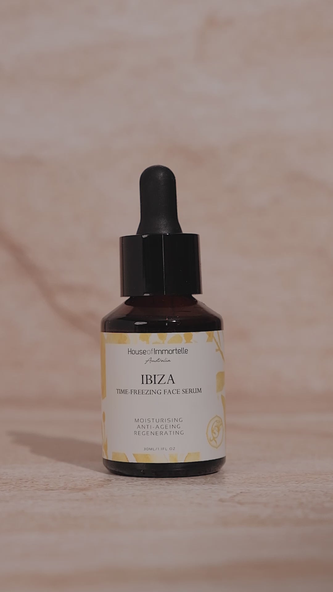 House of Immortelle Ibiza Time Freezing Face Serum in a sophisticated bottle, designed to reduce the appearance of fine lines and wrinkles. This lightweight serum is infused with potent anti-aging ingredients, providing a smooth, rejuvenated complexion for a youthful glow