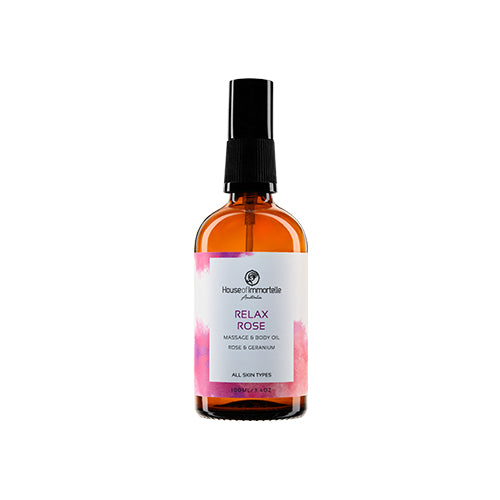 House of Immortelle Relax Rose Massage Body Oil in an elegant bottle, infused with a calming rose scent. The oil is designed to soothe and nourish the skin, with a smooth, luxurious texture, ideal for relaxing massages and providing ultimate relaxation