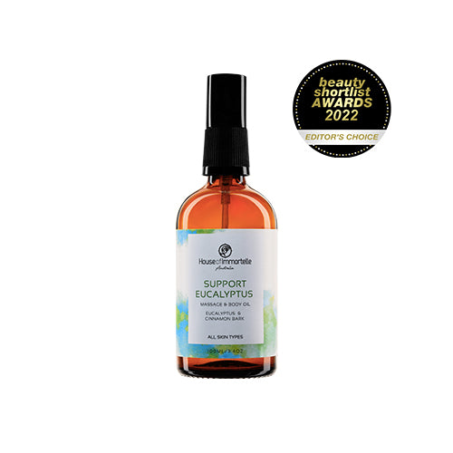 House of Immortelle Support Eucalyptus Massage Body Oil in a sleek bottle, featuring a refreshing eucalyptus scent. The oil is designed to soothe and relieve tension, with a smooth texture and a calming fragrance, ideal for massages and relaxation