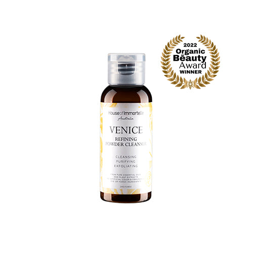 A refined Venice Refining Powder Cleanser by House of Immortelle, a gentle yet effective formula that transforms into a soft foam when mixed with water. This powder cleanser exfoliates and purifies the skin, leaving it smooth, bright, and refreshed. The elegant packaging makes it perfect for a luxurious skincare routine