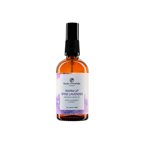 House of Immortelle Warm-Up Spike Lavender Massage Body Oil in a stylish bottle, infused with calming lavender and invigorating spices. The oil is designed to warm and relax muscles, with a smooth texture and a soothing fragrance, ideal for relieving tension and stress